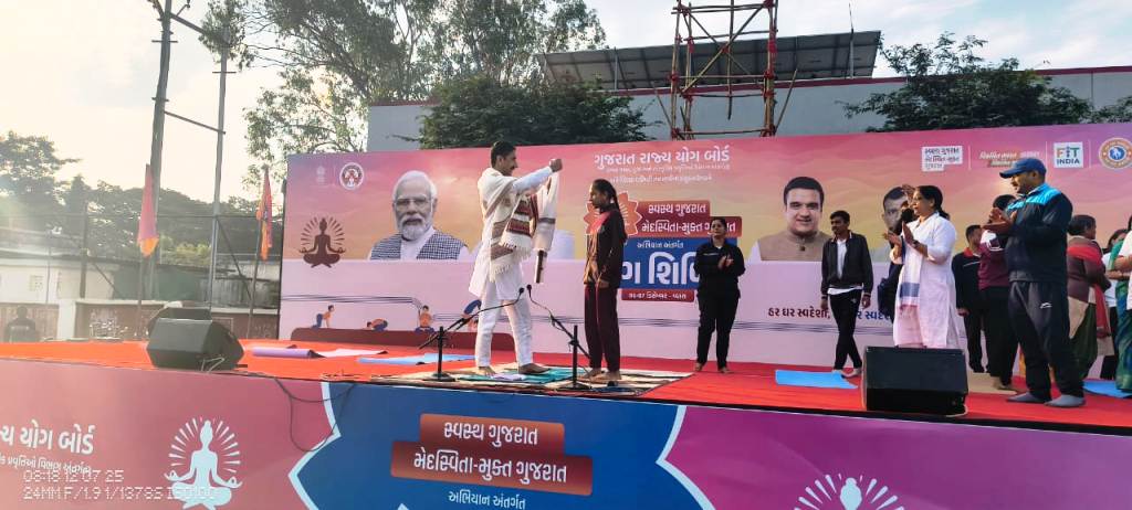 Gamit Nancy Kumari (12 Science), who represented EMRS UKAI at the international level, was honored by the Gujarat State Yoga Board.